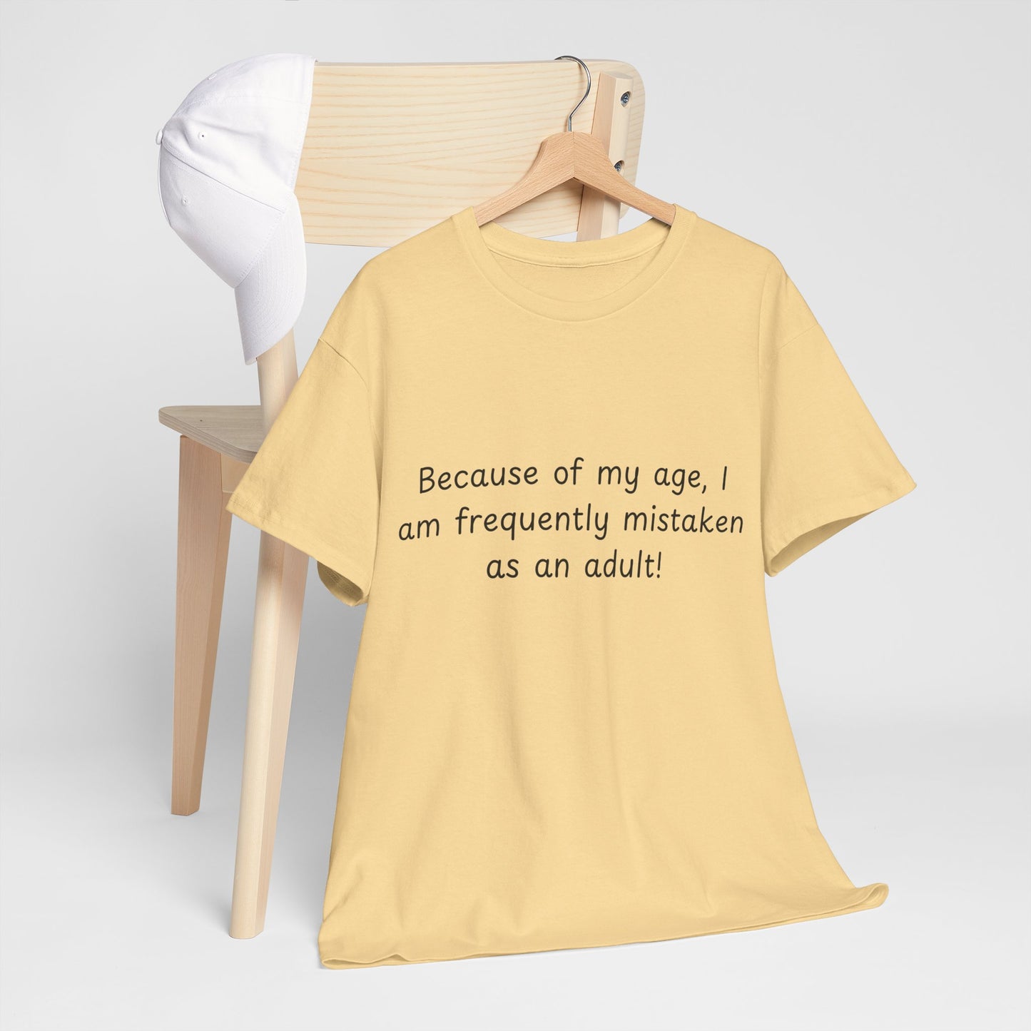 Funny Quote T-Shirt — "Because of my age, I am frequently mistaken as an adult!"